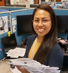 Sawe holding documents
